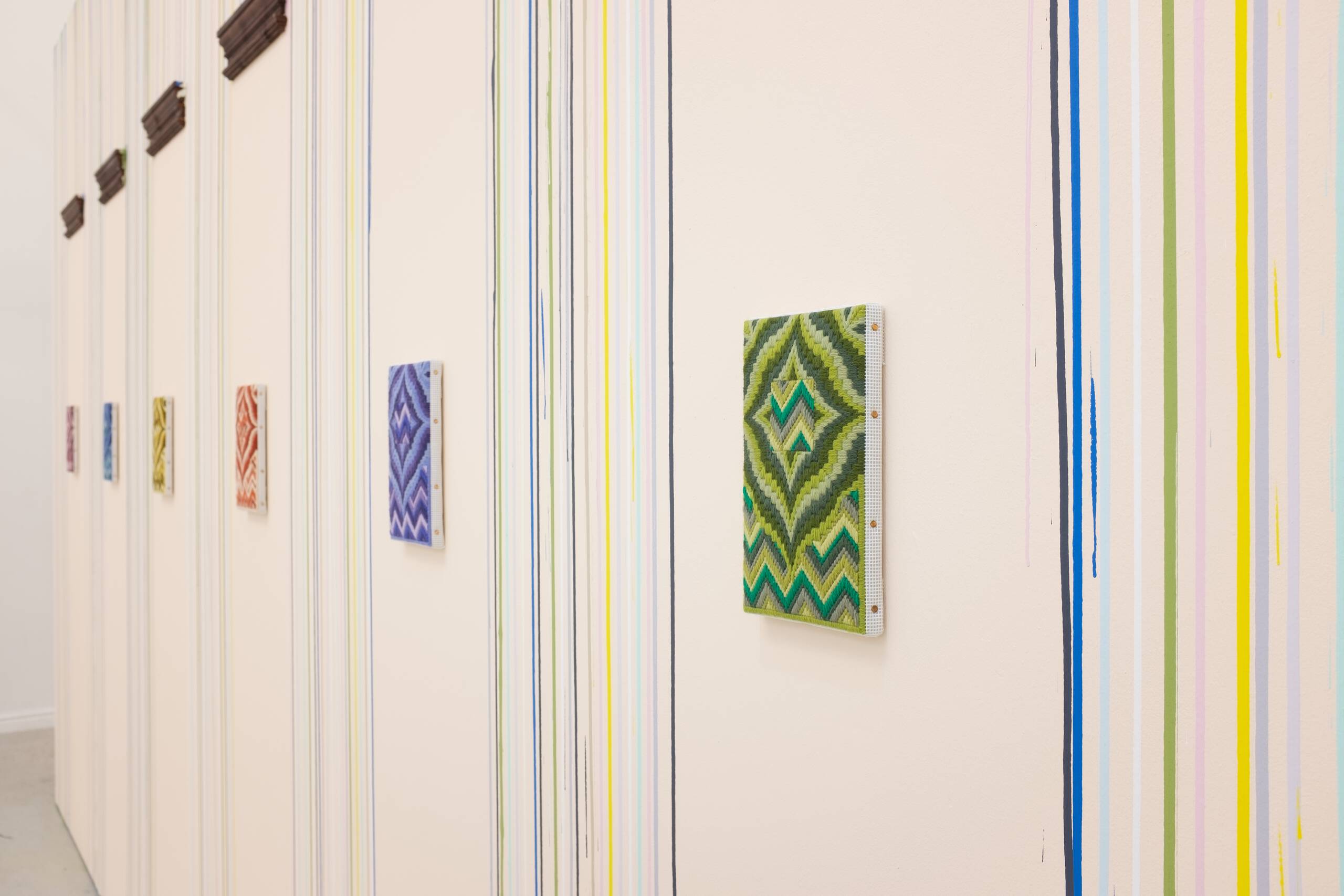 Eaves Leaves (in retrospect, there was a lot of sadness in the times of glory), House paint, wood moulding, wool needlepoint, 2018