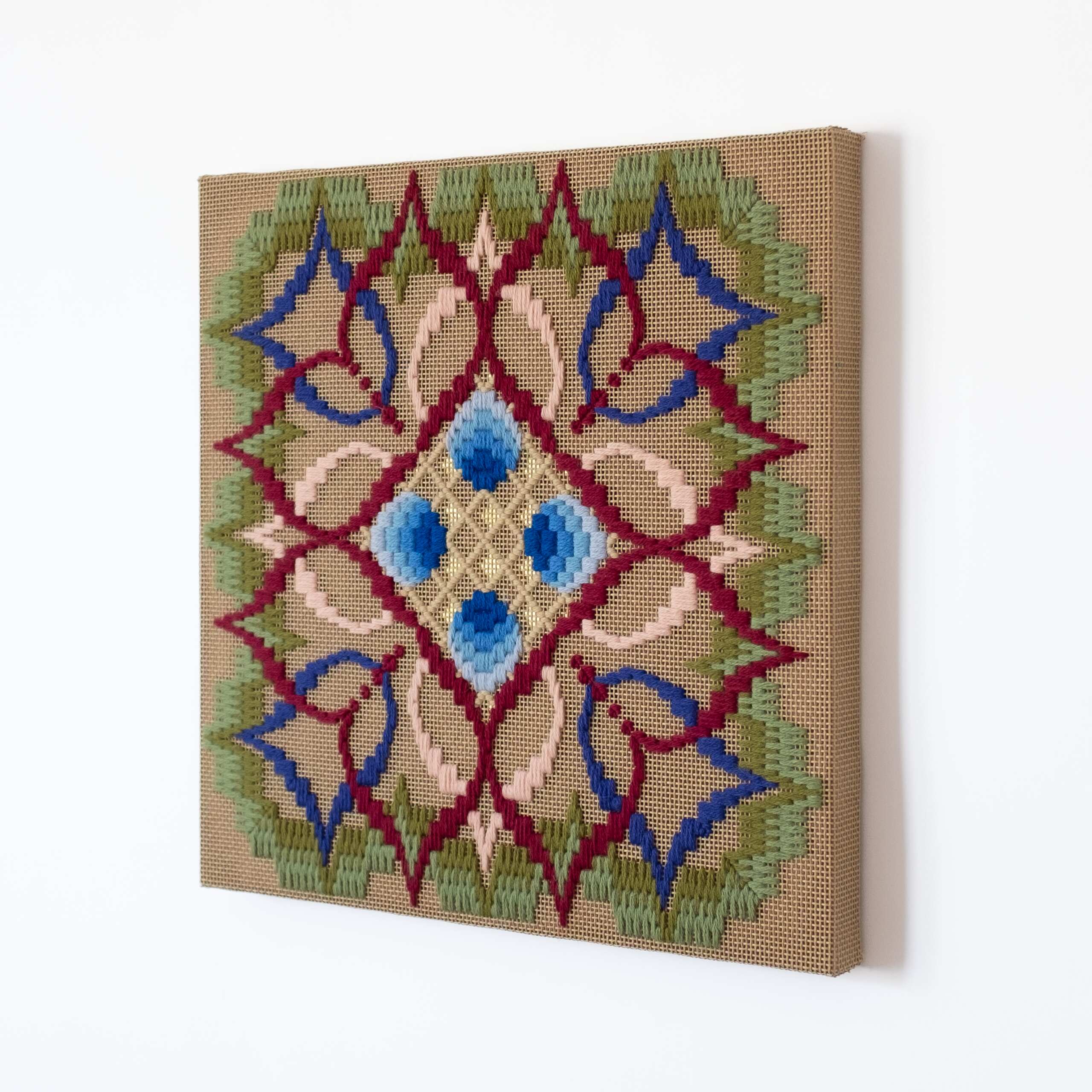 The flower of what's true [blue], Hand-embroidered wool yarn on cotton canvas over cedar panel, 24-carat gold leaf, 2024